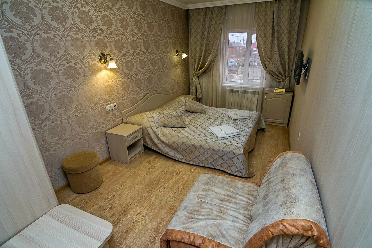 Номер Двухместный номер с двуспальной кроватью и дополнительной кроватью